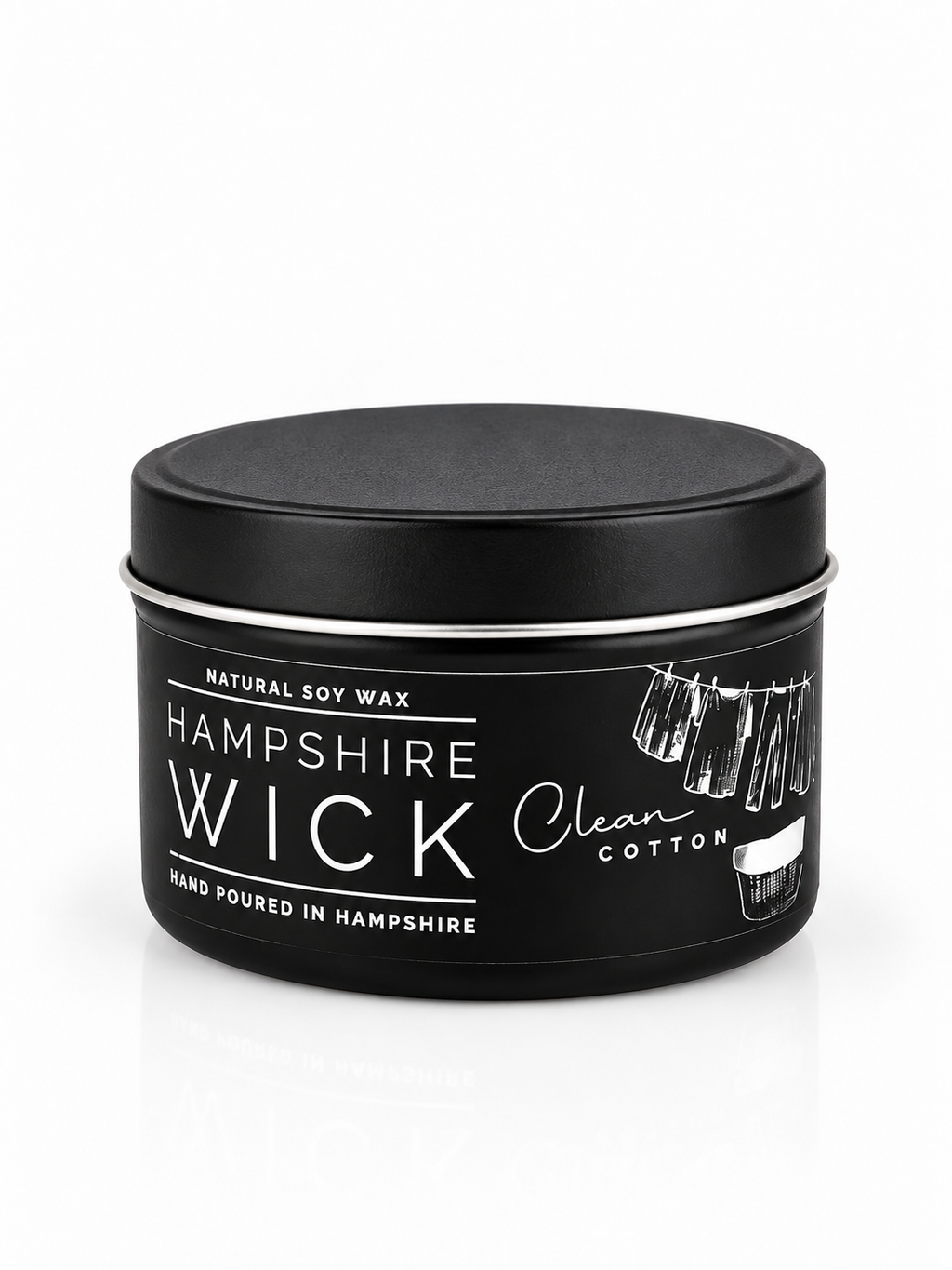 A black metal tin of Hampshire Wick natural soy wax candle, featuring a black lid and a label with white text and illustrations, set against a clean white background.