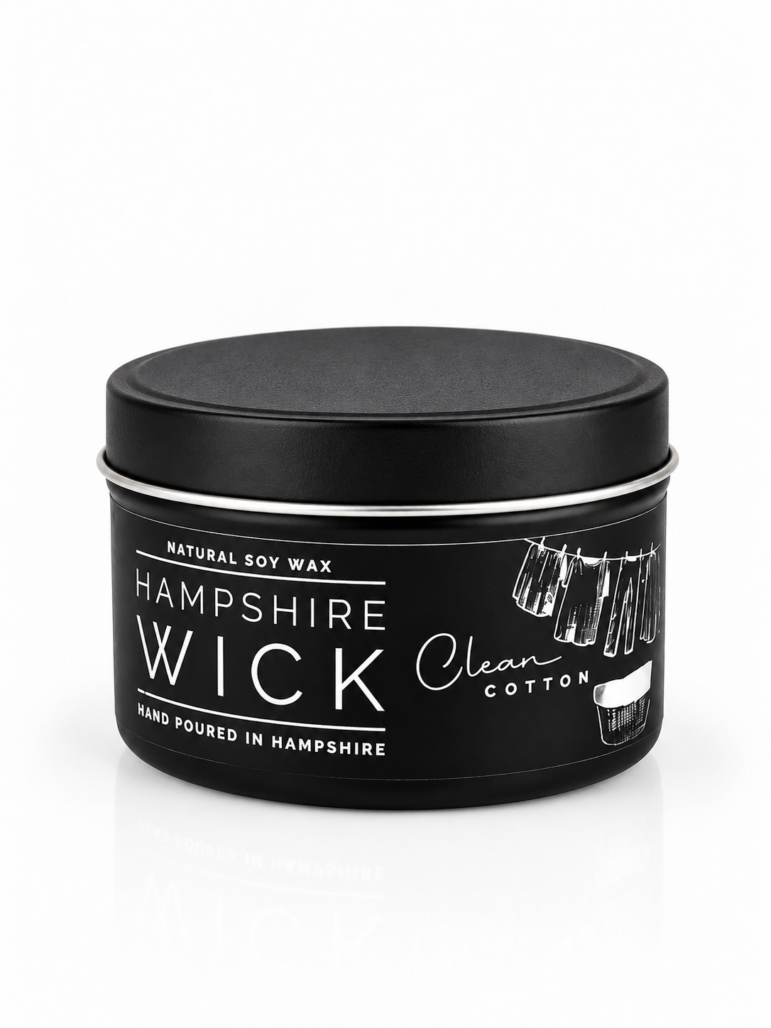 A black metal tin of Hampshire Wick natural soy wax candle, featuring a black lid and a label with white text and illustrations, set against a clean white background.