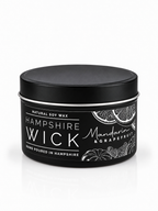 A black tin of Hampshire Wick natural soy wax candle in the Mandarin & Grapefruit scent, shown on a clean white background with a subtle reflection.